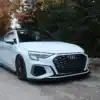 Audi A3 8Y front splitter gloss black angle view showing lip profile and contours