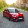 Seat Leon FR Mk4 with gloss black side skirts fitted, angle view showing sill extension line