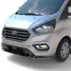 Ford Transit Mk9 with gloss black front splitter fitted, angle view showing lip profile