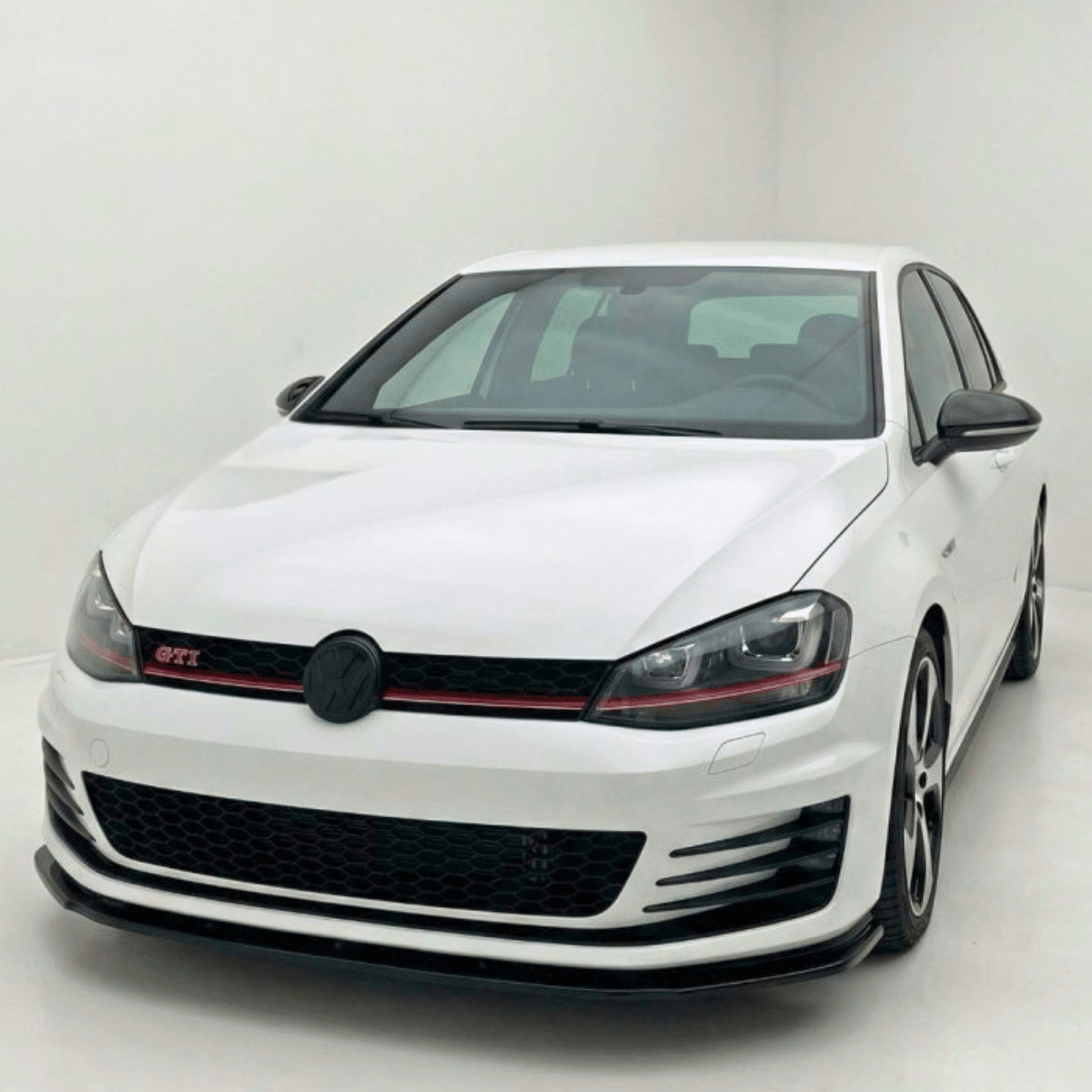 Front Splitter V.1 for VW Golf MK7 GTI / GTD (2013–2016) 2 VW Golf GTI MK7 Front Splitter Low Angle View Gloss Black ABS Bumper Lip