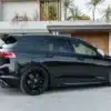 VW Golf R Mk8 with gloss black side skirts fitted, angle view showing sill extension line