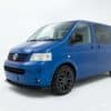 VW Transporter T5 front splitter in gloss black finish for 2003-2009 pre-facelift models.