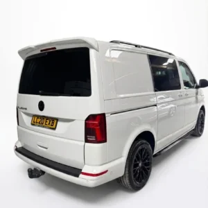 Black textured rear bumper protector for VW Transporter T6 and T6.1 (2015 onwards), prevents paintwork scratches during loading.